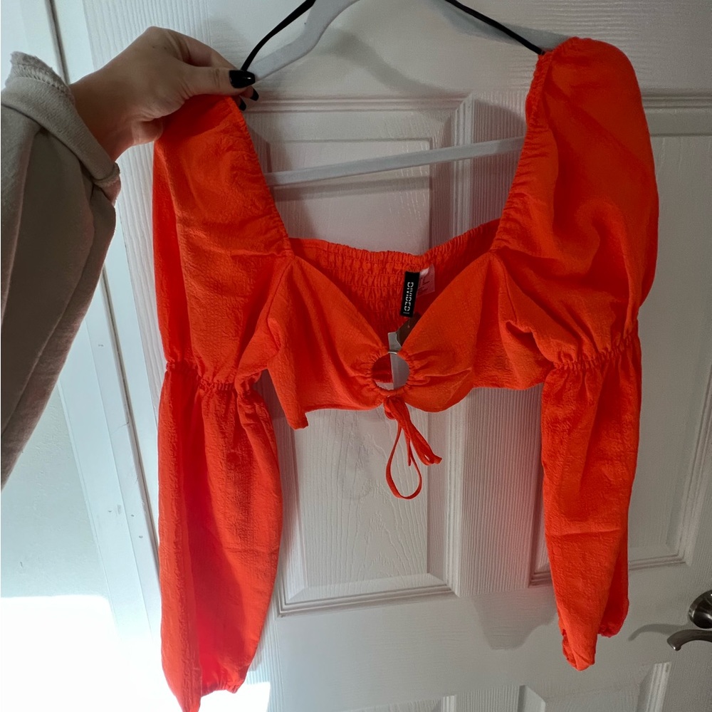 Orange cropped long sleeve top